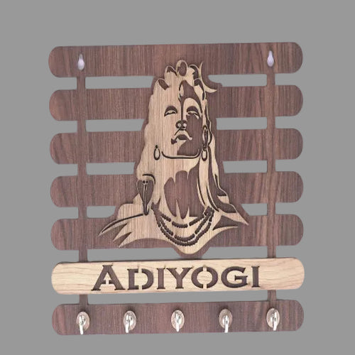 Wooden wall hook with engraved face and 'Adiyogi' branding on a white background